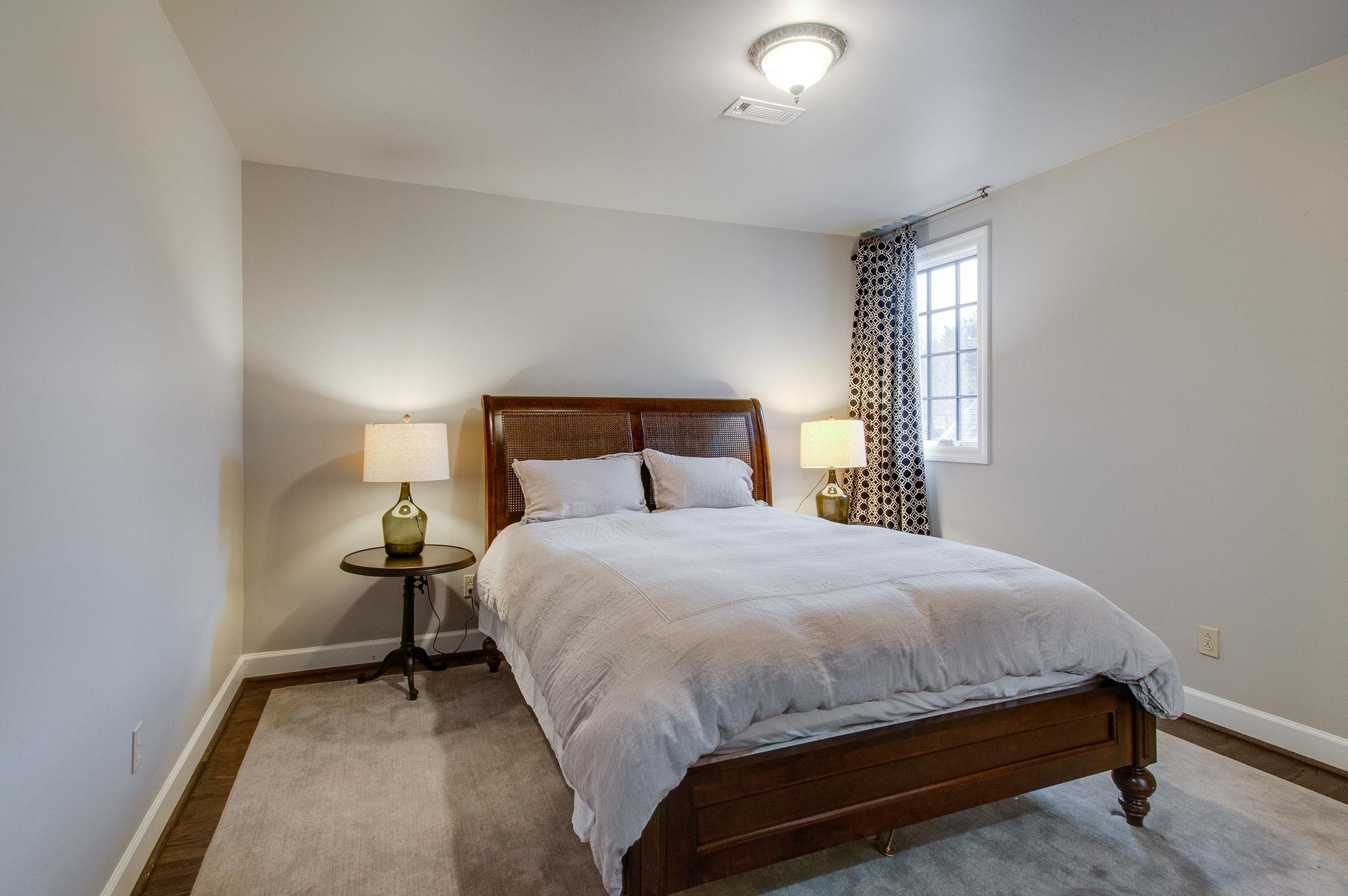 232 Cherokee Road Nashville, TN 37205 - Photo 20 of 24 a bedroom with a bed and window