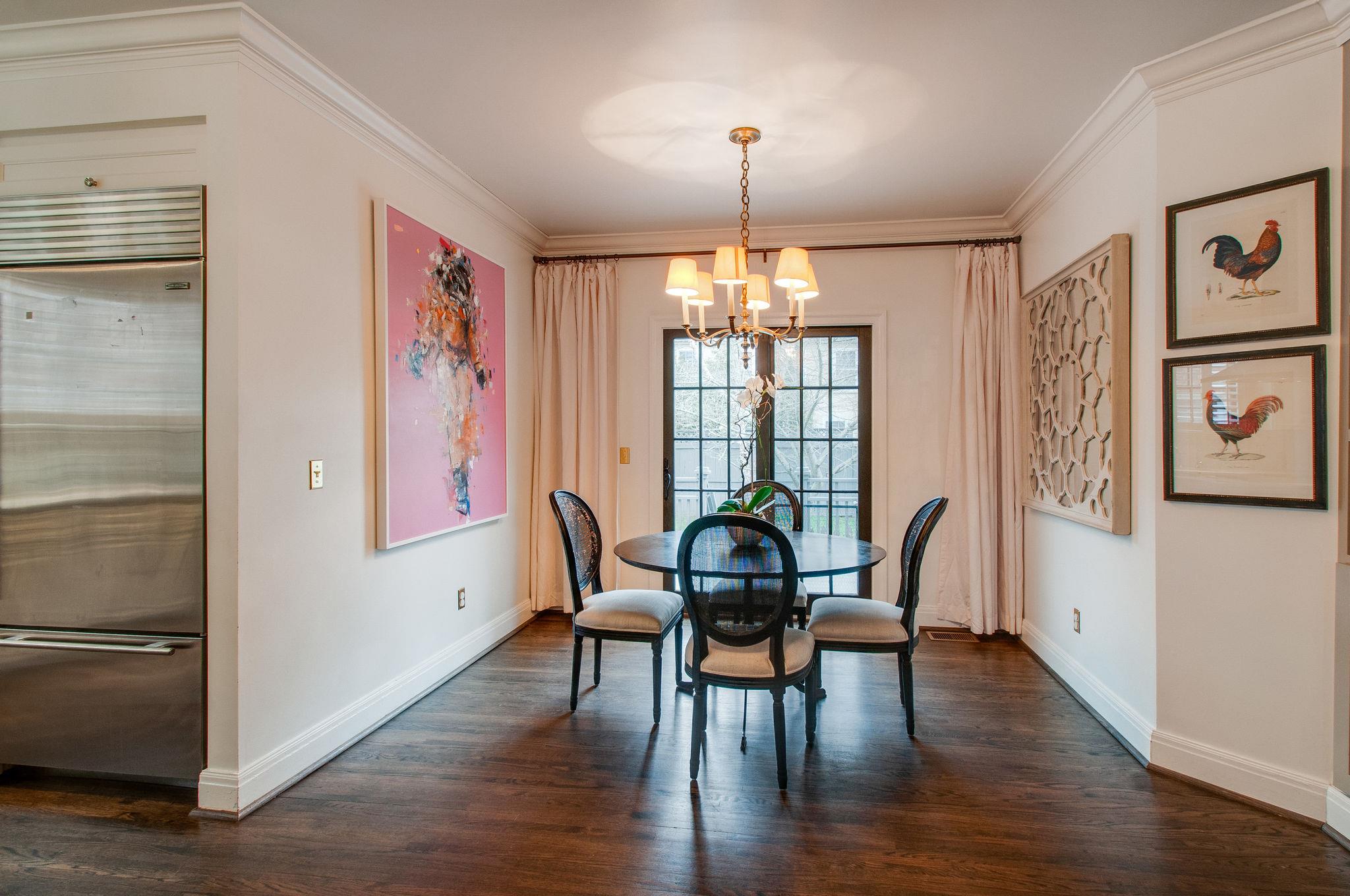 232 Cherokee Road Nashville, TN 37205 - Photo 10 of 24 a view of a dining room with furniture window and wooden floor