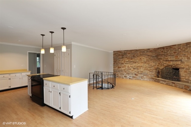 5 Oakwood Road Indian Creek, IL 60061 - Photo 4 of 18 a spacious bedroom with a bed and a table