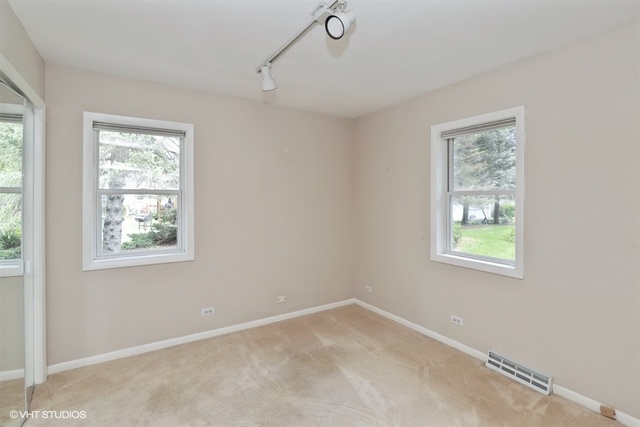 5 Oakwood Road Indian Creek, IL 60061 - Photo 8 of 18 a view of an empty room with a window
