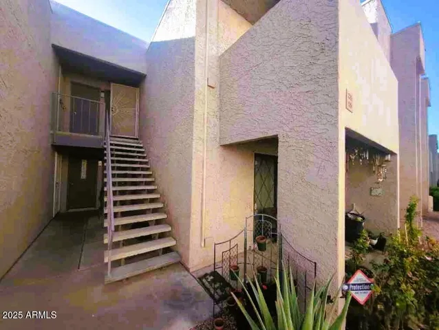 a view of a house with a street