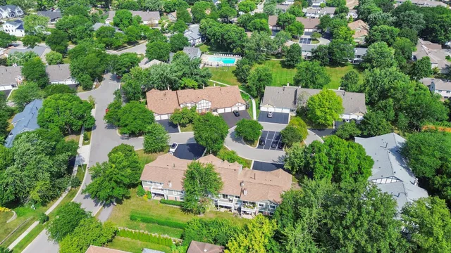 an aerial view of a house with yard swimming pool and outdoor seating