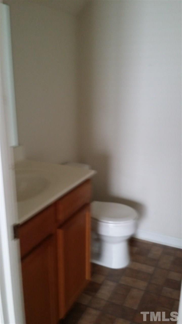 4917 Windsprint Way Raleigh, NC 27616 - Photo 4 of 13 a white toilet sitting next to a shower