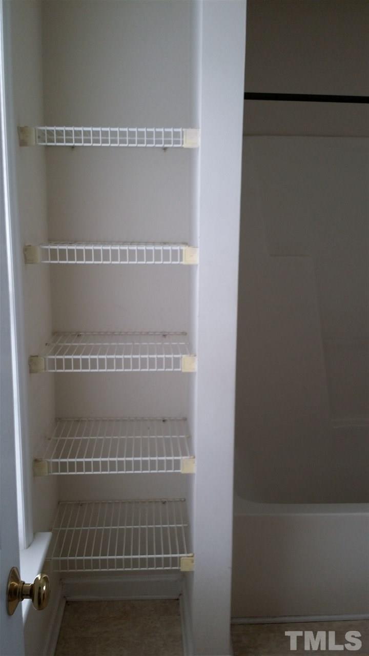 4917 Windsprint Way Raleigh, NC 27616 - Photo 9 of 13 a view of a room with racks on the wall