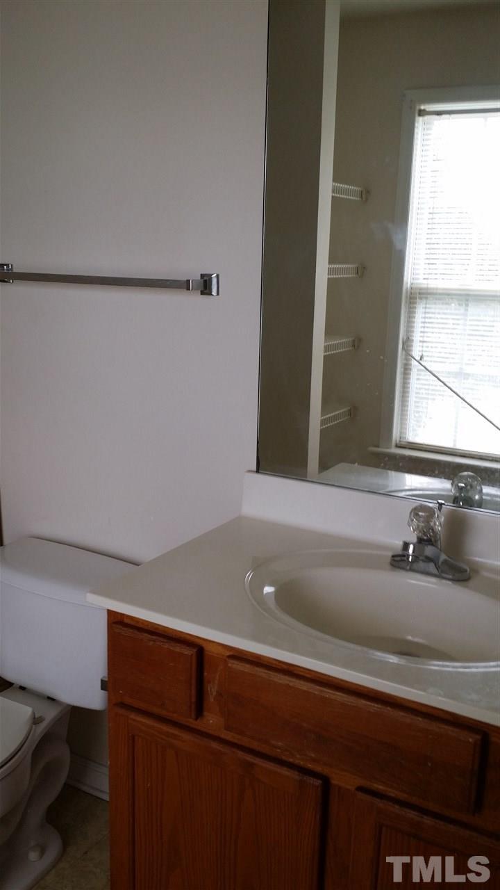 4917 Windsprint Way Raleigh, NC 27616 - Photo 10 of 13 a close view of sink cabinets and a couch