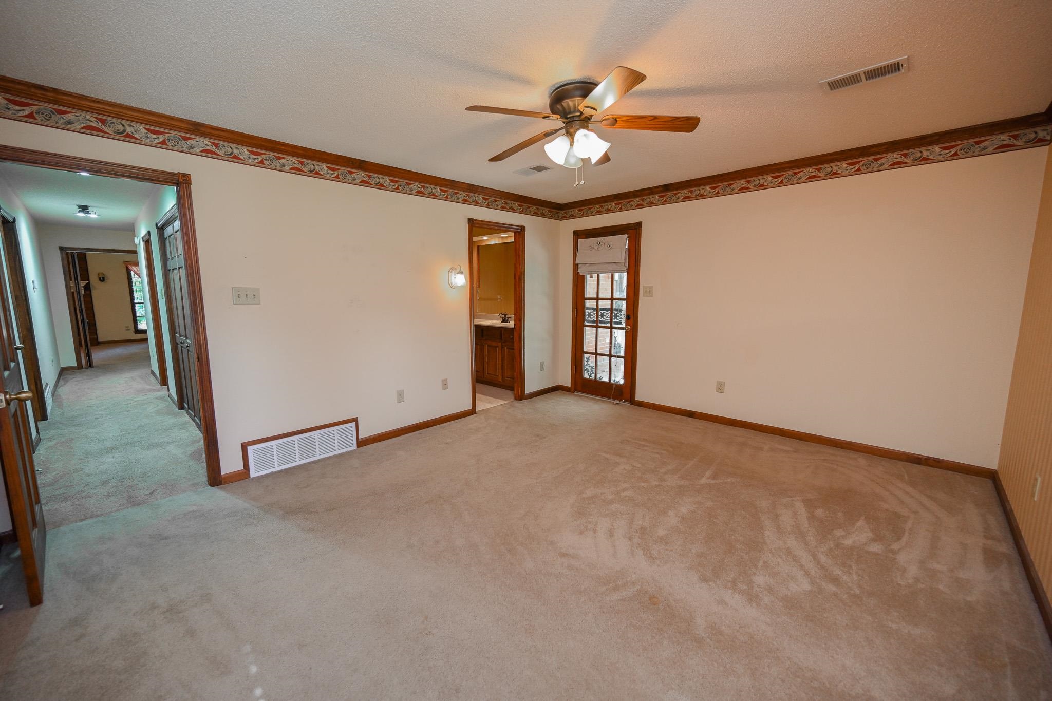 3746 Broadway Road Bartlett, TN 38135 - Photo 17 of 39 Primary has spacious walk-in closet and door leading to back covered patio and private primary bathroom.