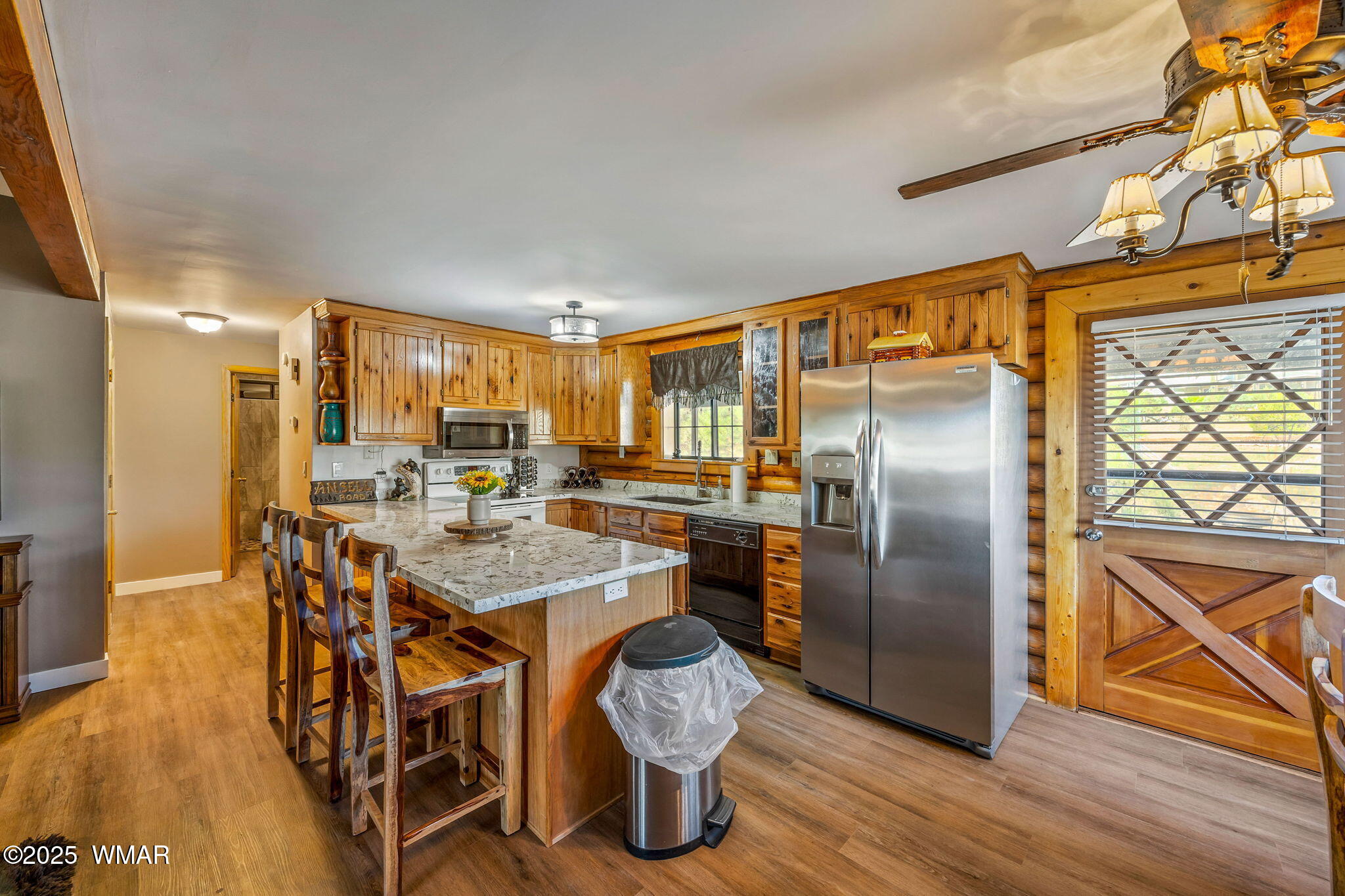 1850 Ansell Road Heber, AZ 85928 - Photo 11 of 34 a kitchen with stainless steel appliances granite countertop a refrigerator a stove and a wooden floor