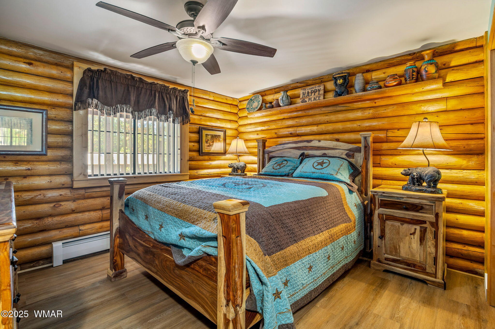 1850 Ansell Road Heber, AZ 85928 - Photo 14 of 34 a bedroom with a bed a dresser and wooden floor