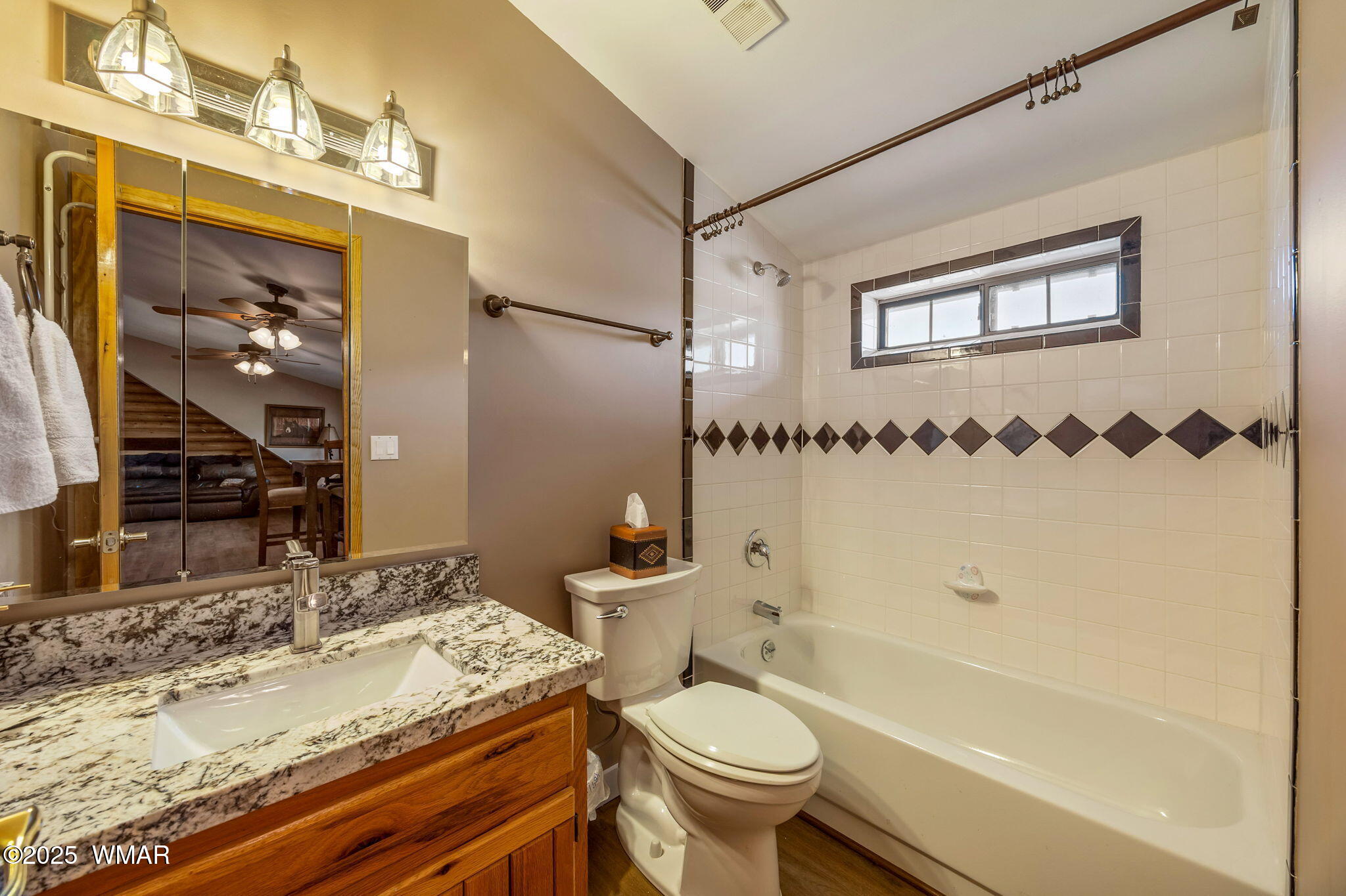 1850 Ansell Road Heber, AZ 85928 - Photo 21 of 34 a bathroom with a granite countertop sink toilet mirror and bathtub