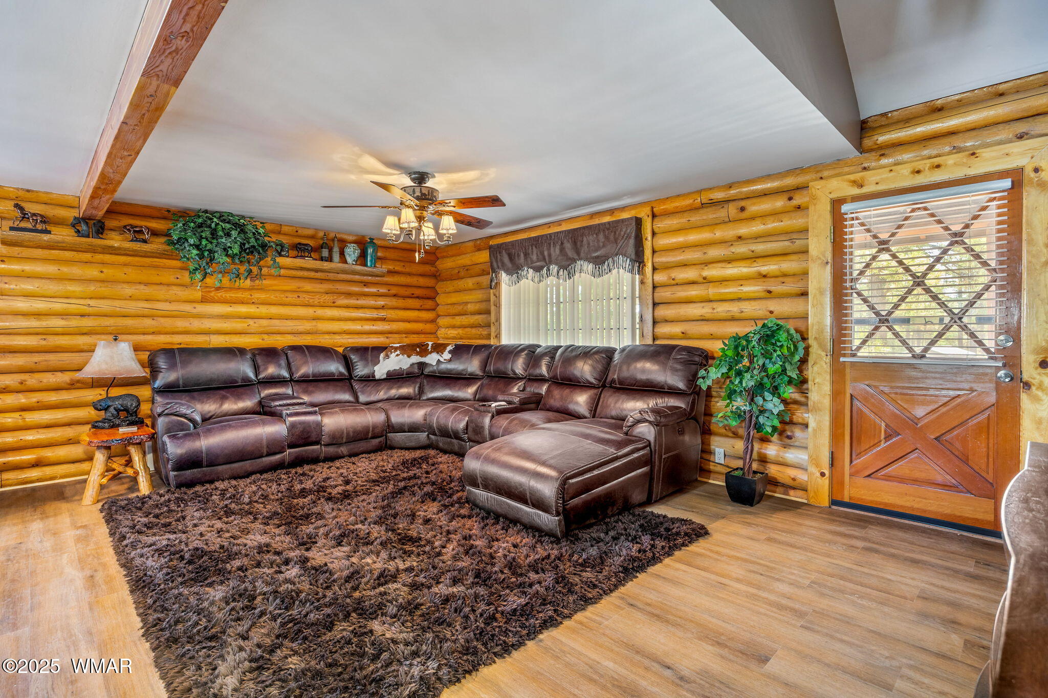 1850 Ansell Road Heber, AZ 85928 - Photo 8 of 34 a living room with a couch a rug and a potted plant