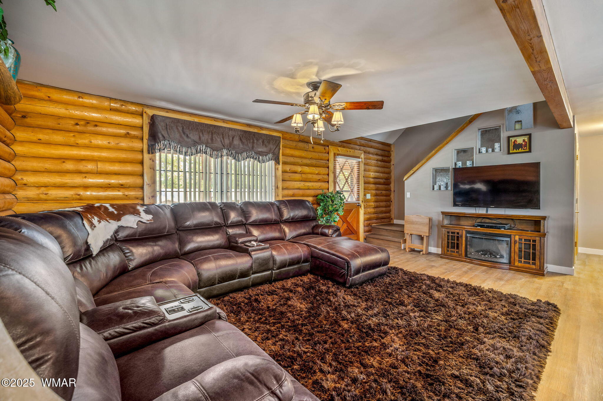 1850 Ansell Road Heber, AZ 85928 - Photo 9 of 34 a living room with furniture a ceiling fan and a flat screen tv