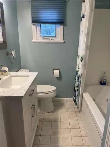 a bathroom with a bathtub and toilet