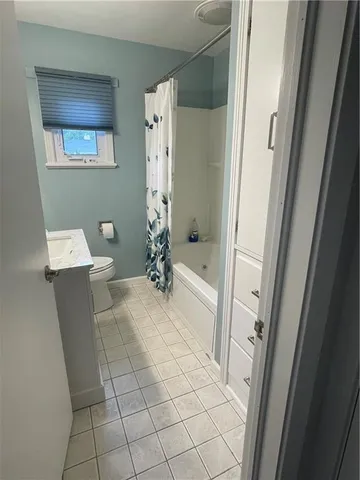 an empty room with a empty space and a window