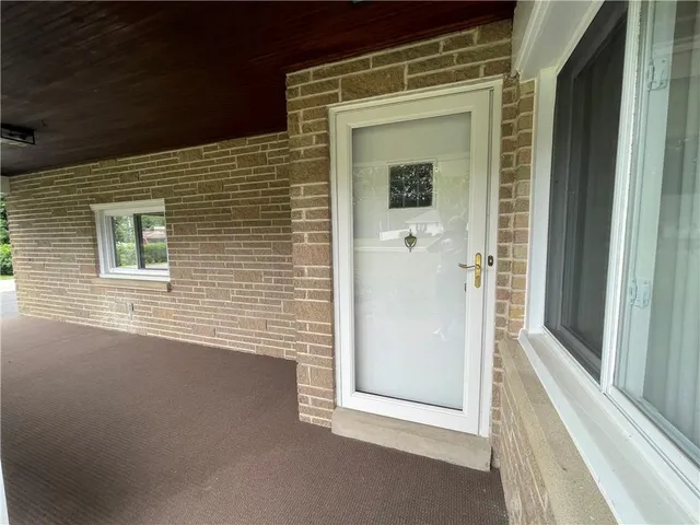 a view of a door and a window