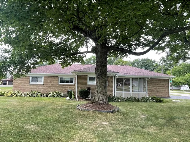 a view of a house with a yard