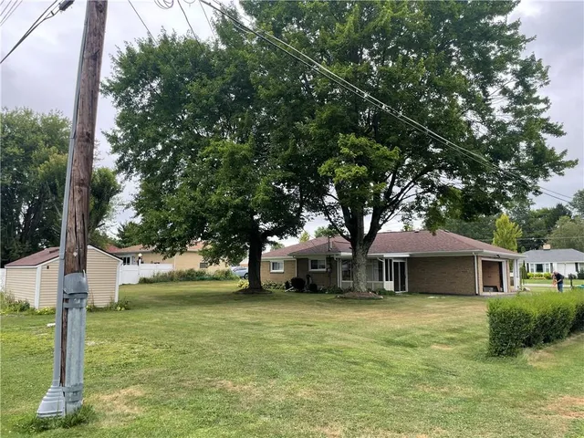 a front view of a house with garage