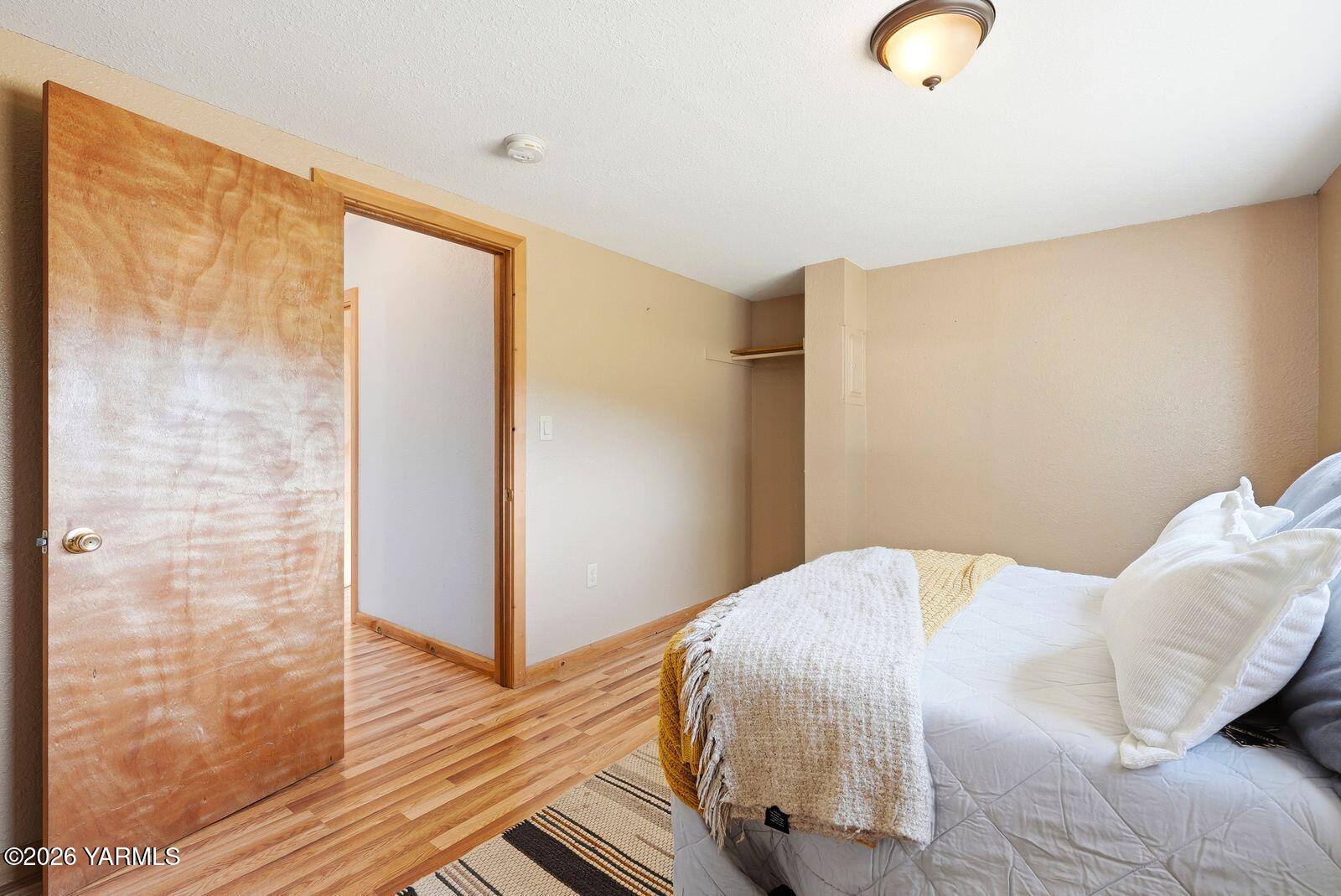 3780 Nile Road Naches, WA 98937 - Photo 20 of 43 a bedroom with a bed and wooden floor