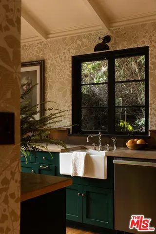 a bathroom with a sink and a window