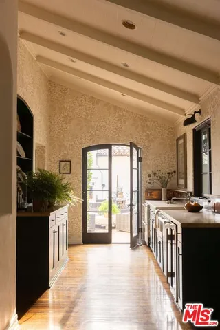 a kitchen with stainless steel appliances granite countertop a stove and a refrigerator
