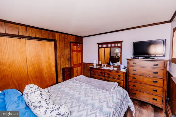 a bed room with a bed and a couch