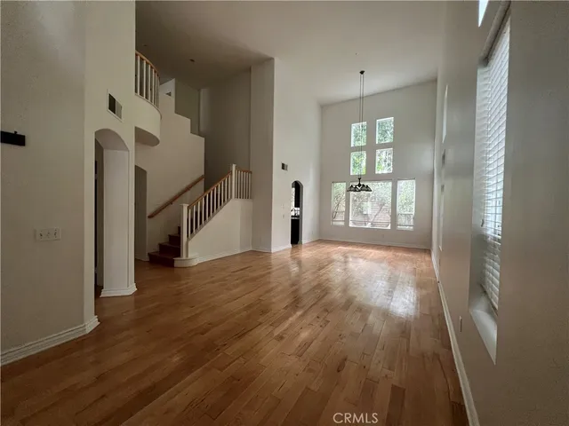 a view of an entryway with wooden floor