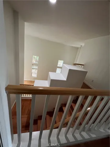a view of balcony with furniture and wooden floor