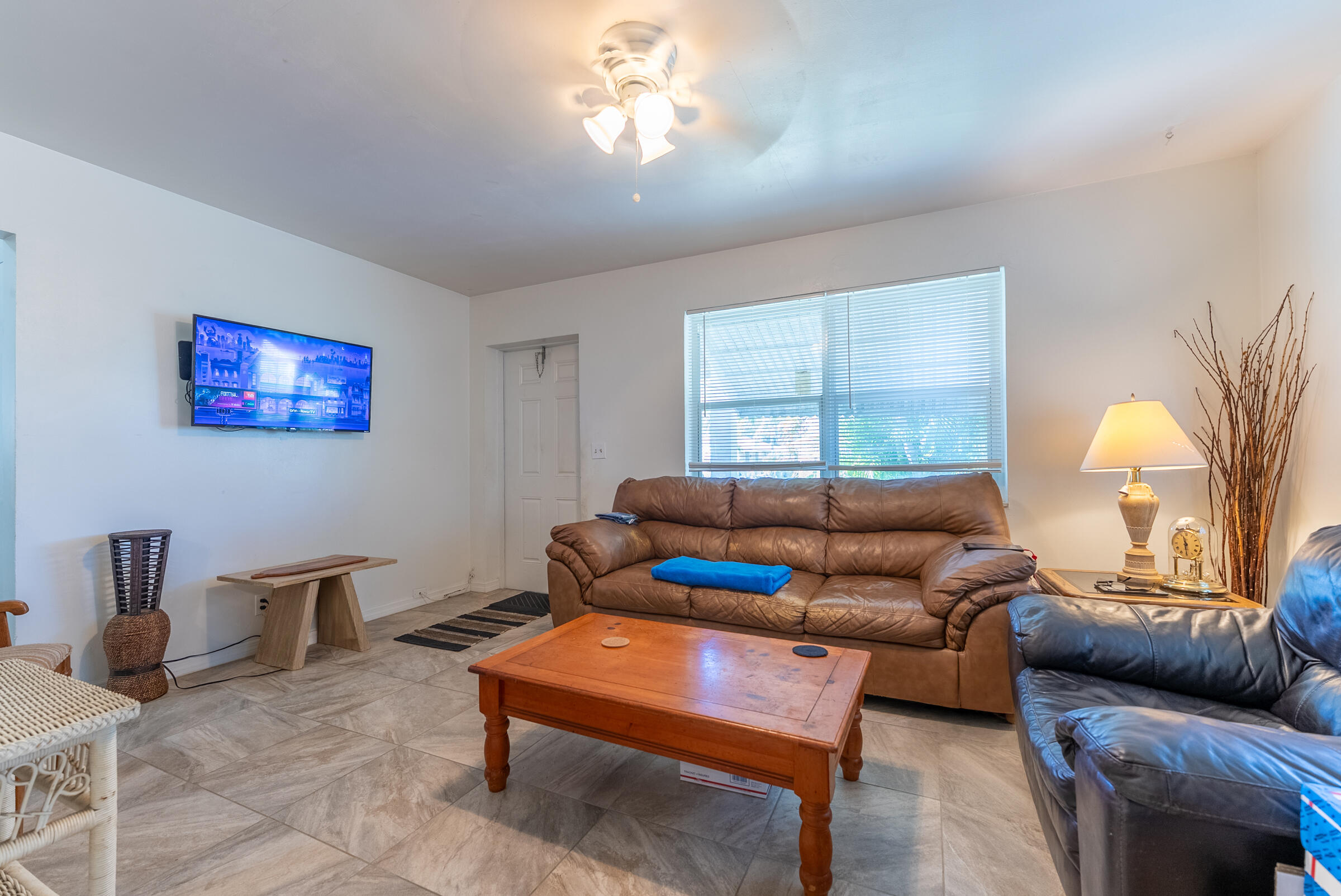 730 North 5th Street Lantana, FL 33462 - Photo 11 of 39 a living room with furniture a window and a flat screen tv