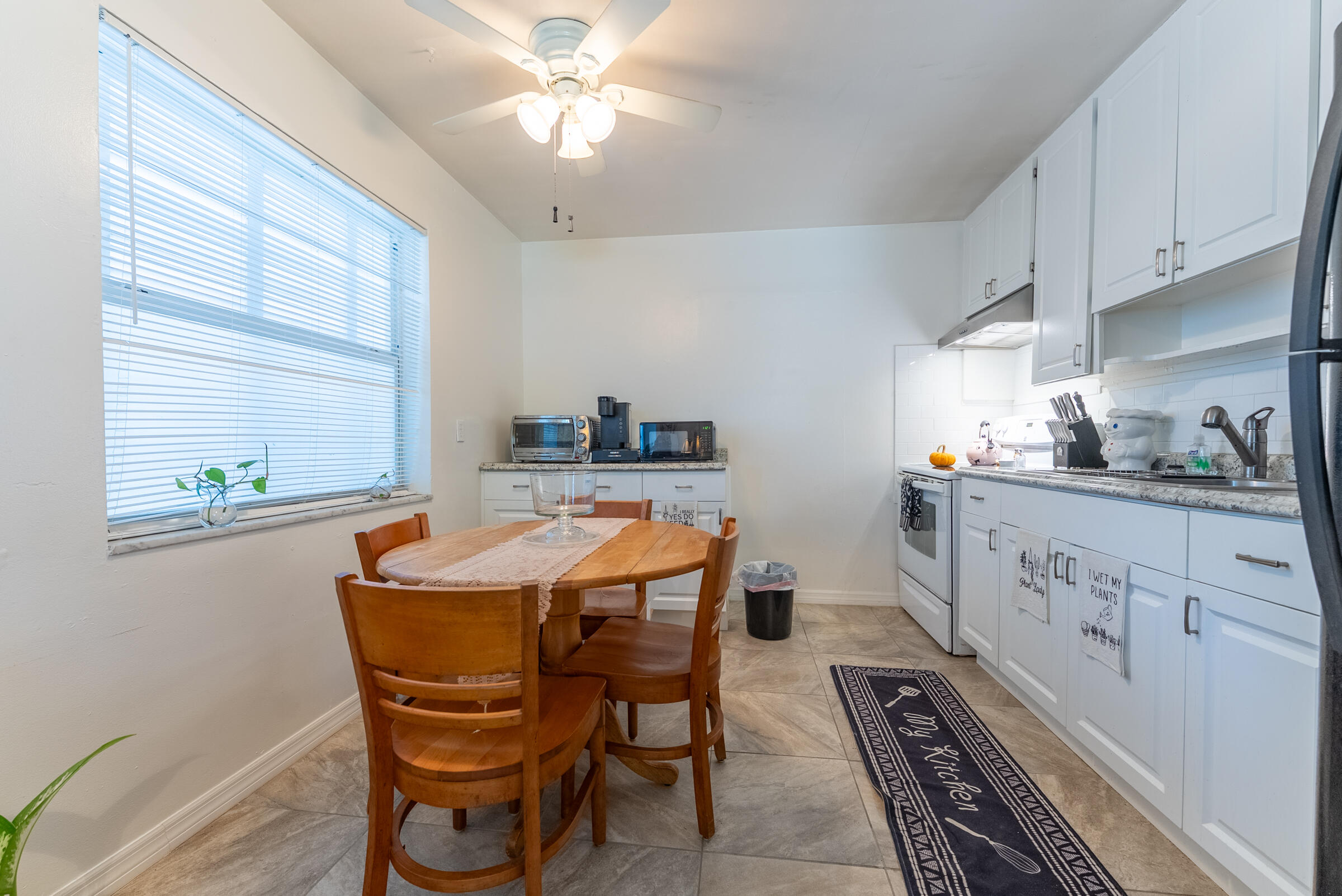 730 North 5th Street Lantana, FL 33462 - Photo 12 of 39 a dining room with furniture and window