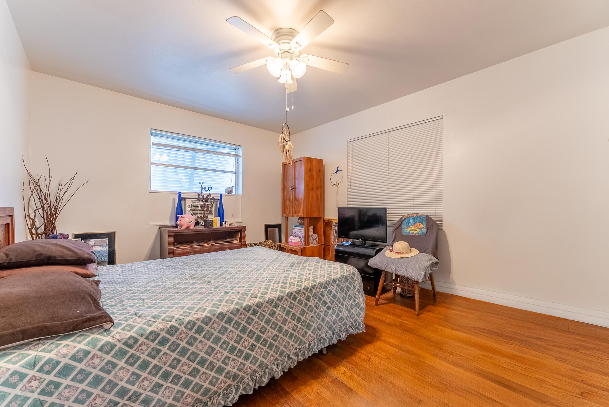 730 North 5th Street Lantana, FL 33462 - Photo 15 of 39 a bedroom with a bed and wooden floor