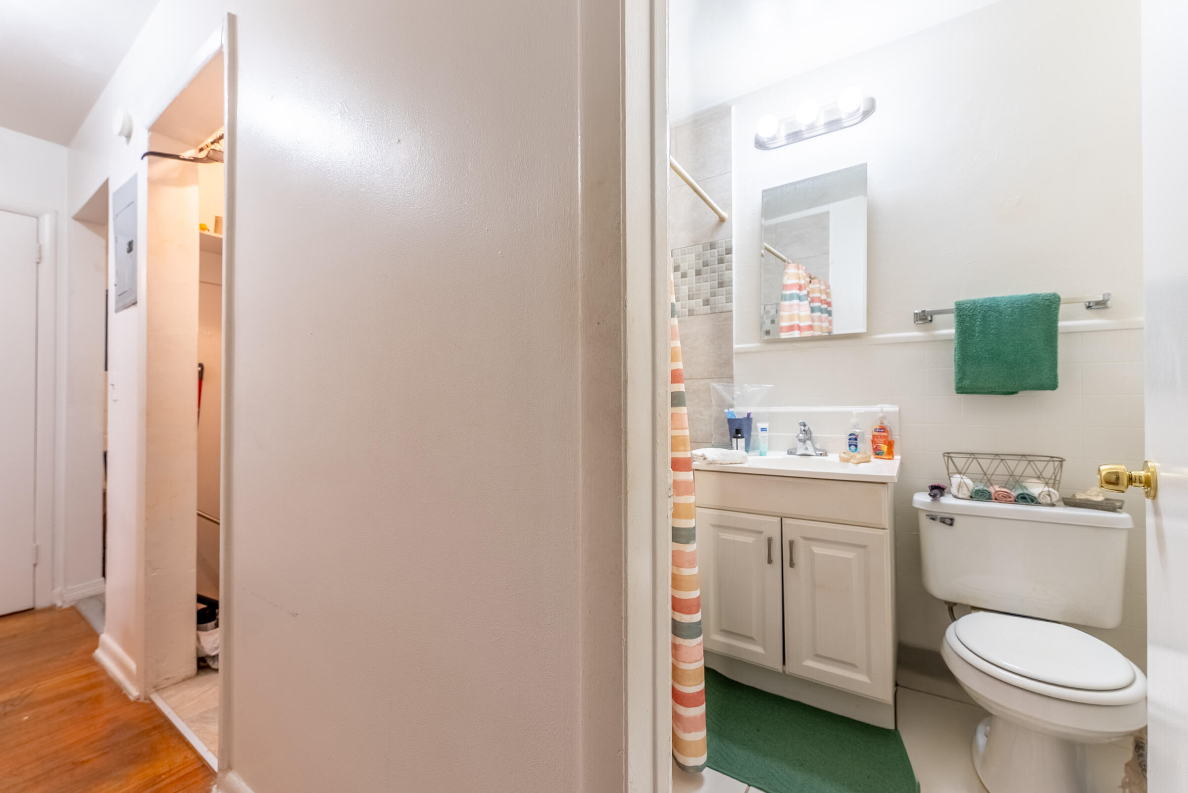 730 North 5th Street Lantana, FL 33462 - Photo 18 of 39 a bathroom with a toilet sink vanity and mirror