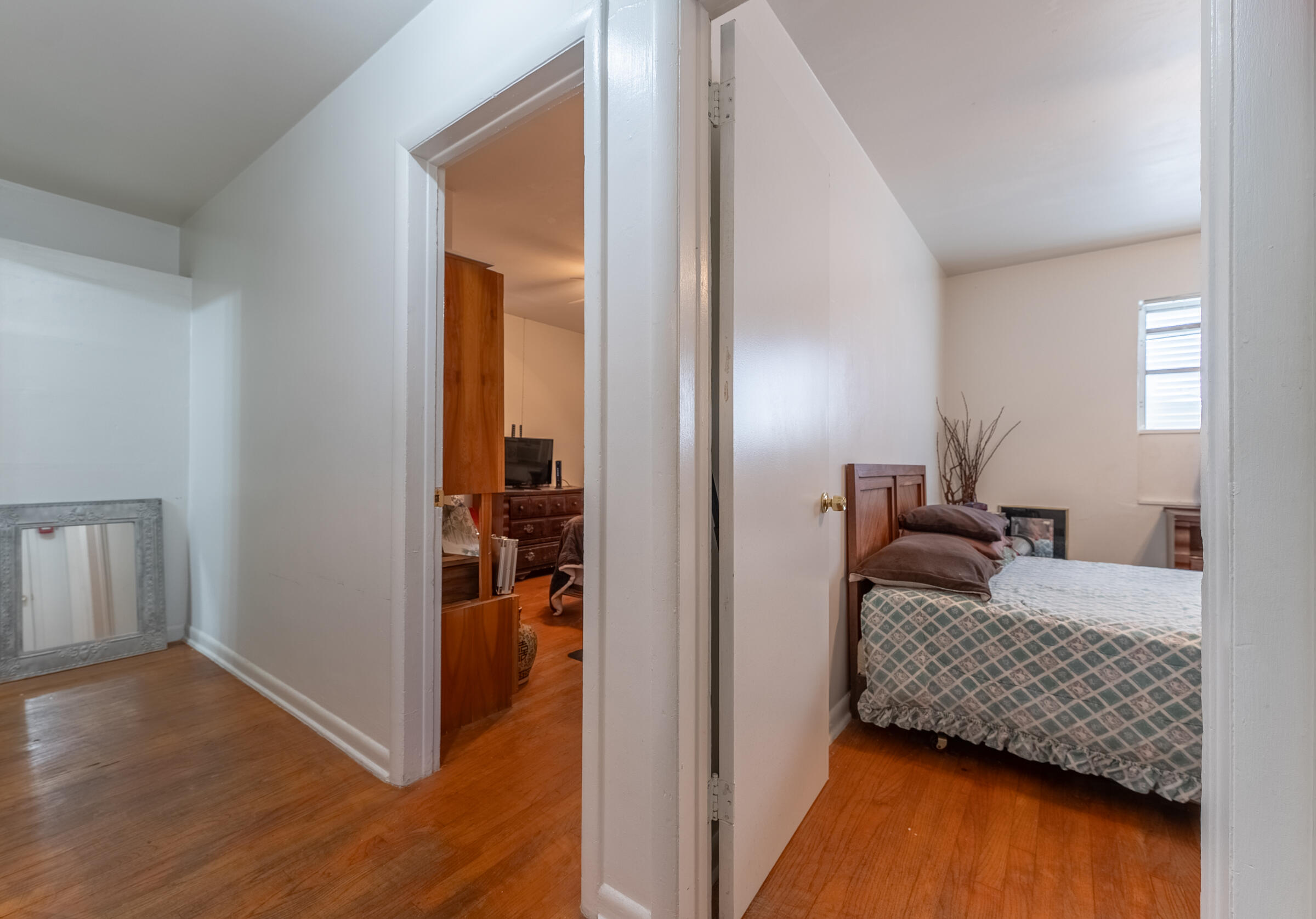 730 North 5th Street Lantana, FL 33462 - Photo 21 of 39 a bedroom with a bed and wooden floor