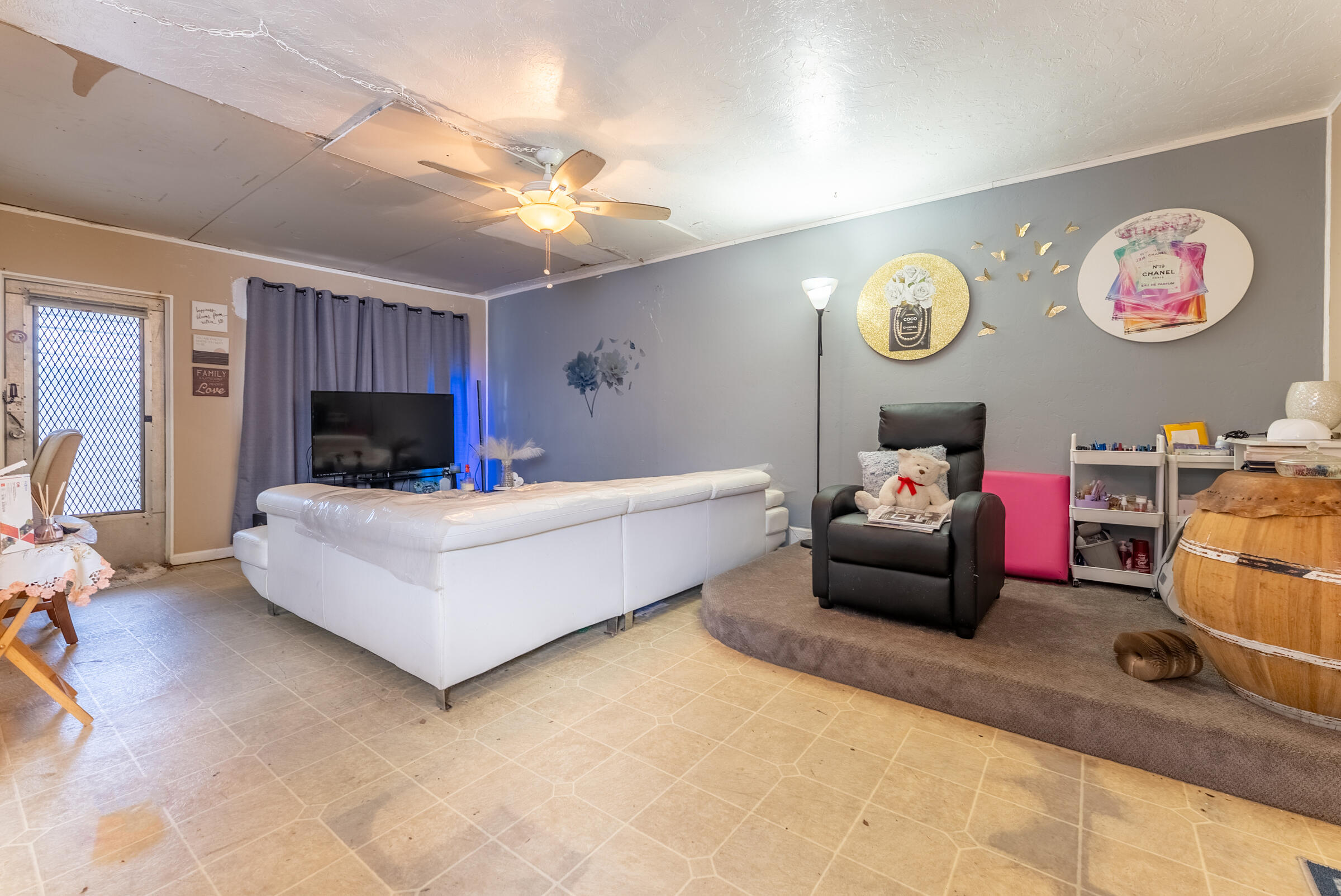 730 North 5th Street Lantana, FL 33462 - Photo 24 of 39 a living room with furniture and a flat screen tv