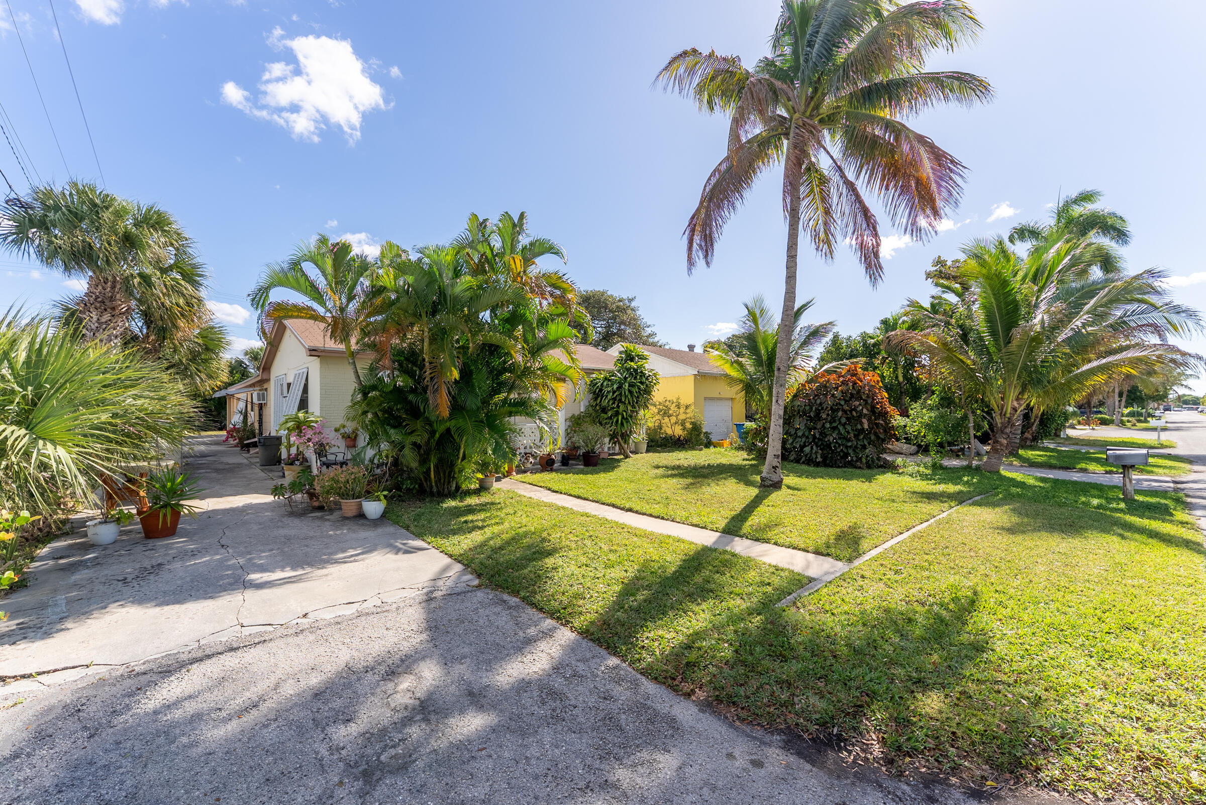 730 North 5th Street Lantana, FL 33462 - Photo 7 of 39 a swimming pool with palm trees