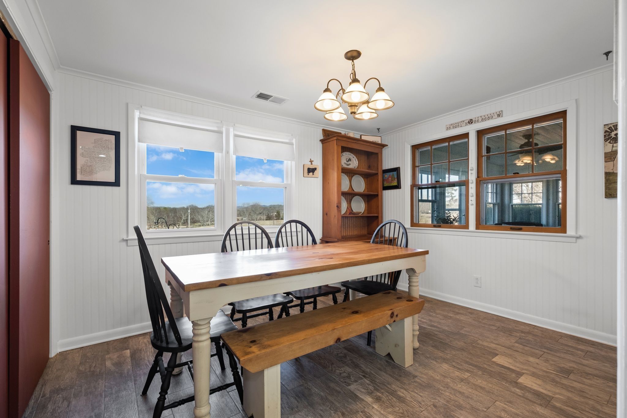 4125 Trinity Road Franklin, TN 37067 - Photo 24 of 44 a view of a dining room with furniture wooden floor and chandelier