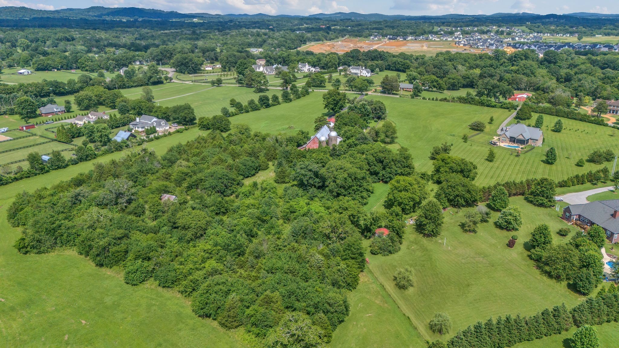 4125 Trinity Road Franklin, TN 37067 - Photo 43 of 44 an aerial view of green landscape with trees houses and mountain view