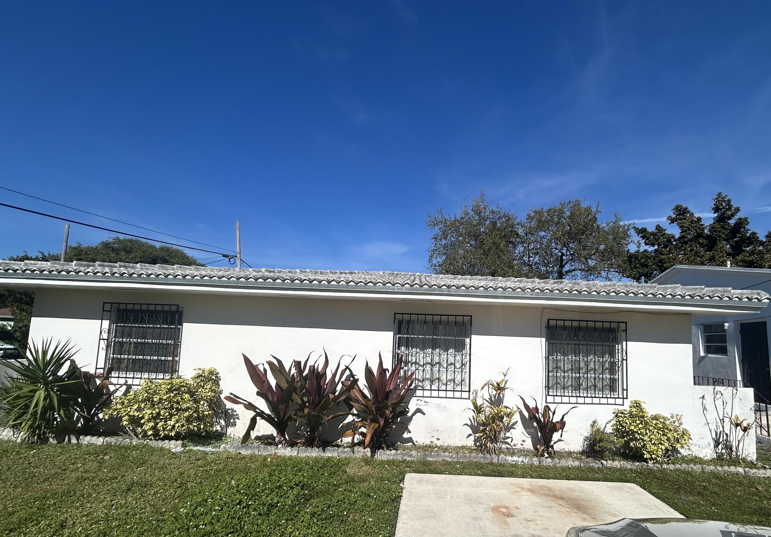 front view of a house with a yard