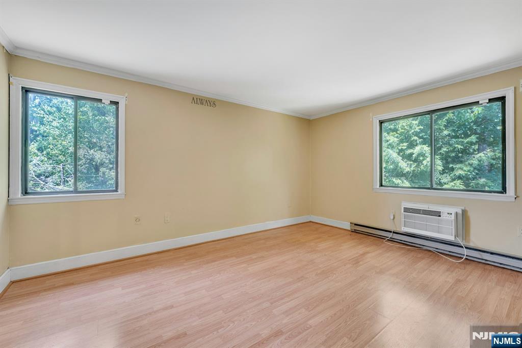 666 Mill Street, Unit C6 Belleville, NJ 07109 - Photo 14 of 25 wooden floor in an empty room with a window