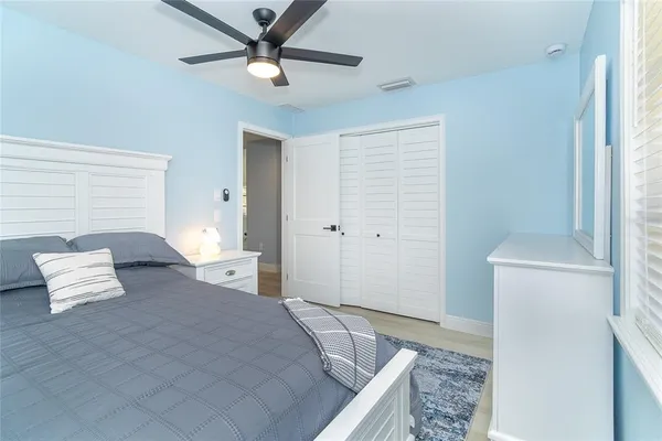 a bedroom with a bed and a couch