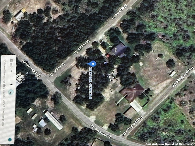 an aerial view of multiple houses with yard