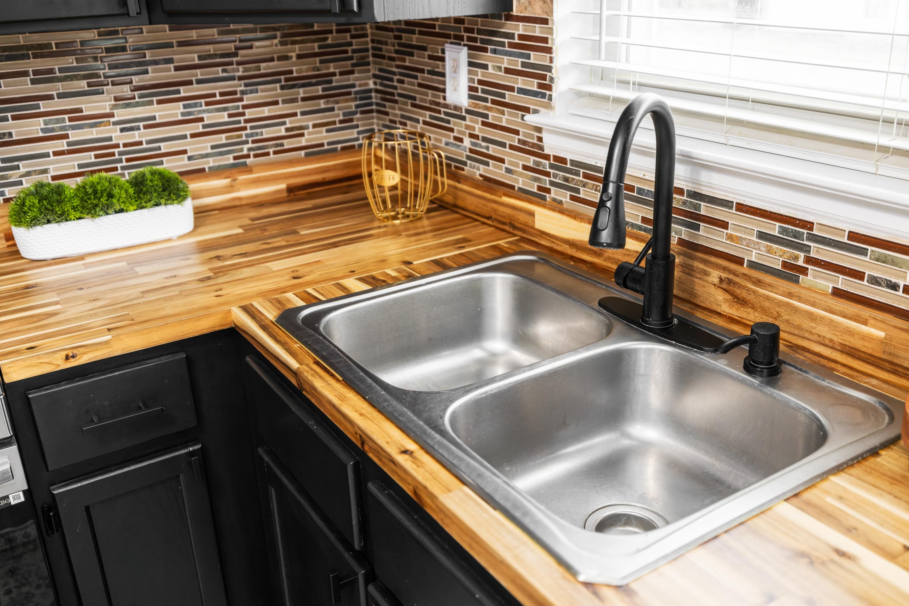 77 Greenway Road Stuarts Draft, VA 24477 - Photo 16 of 57 a kitchen with a sink and a refrigerator