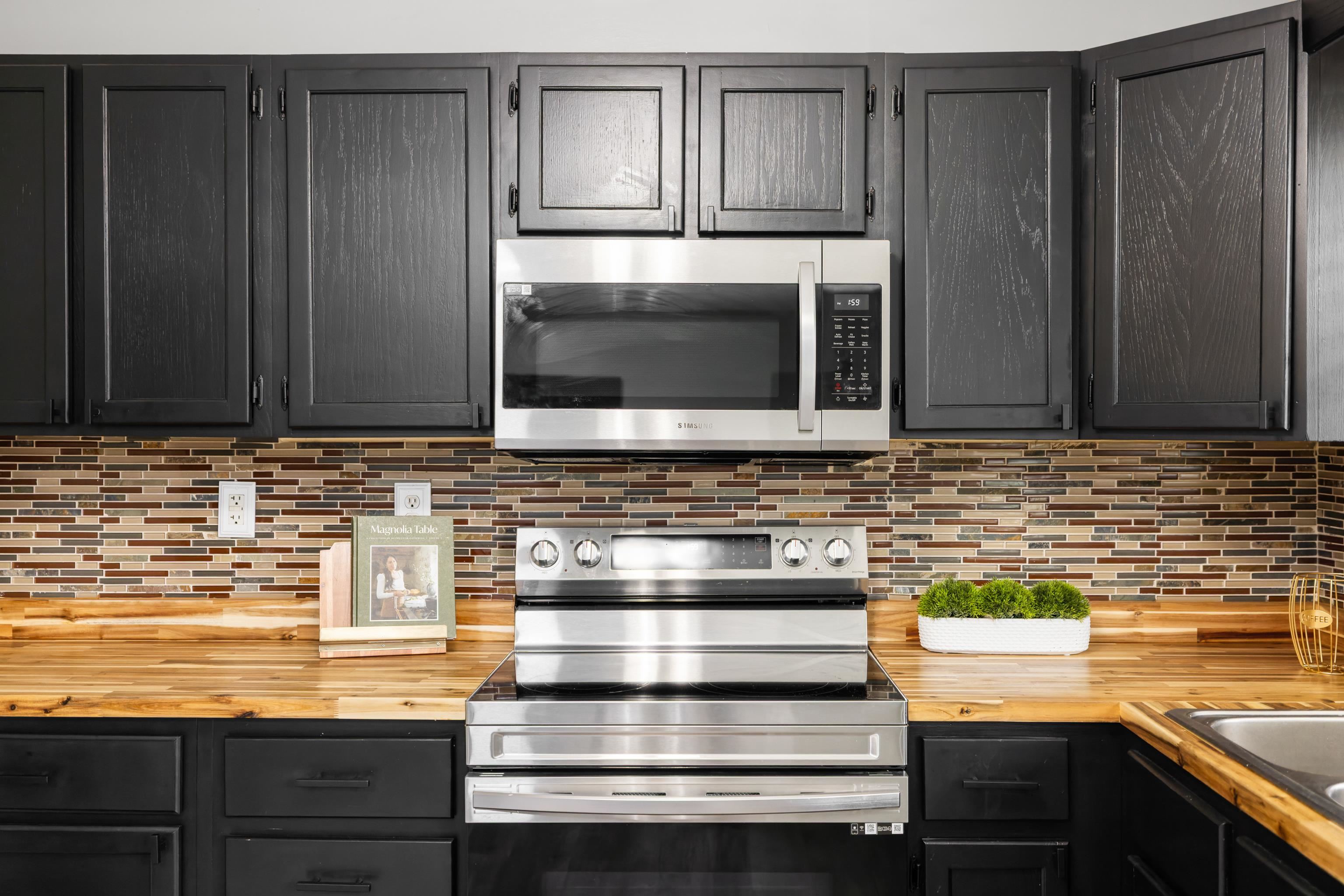 77 Greenway Road Stuarts Draft, VA 24477 - Photo 19 of 57 a kitchen with granite countertop stainless steel appliances and cabinets