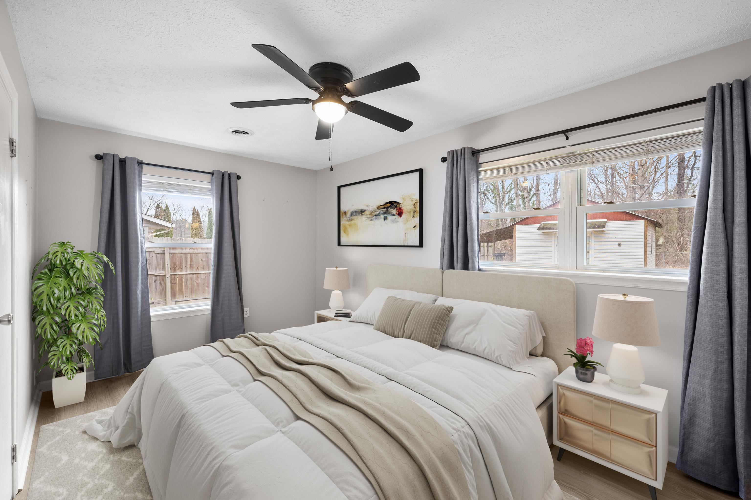 77 Greenway Road Stuarts Draft, VA 24477 - Photo 27 of 57 a bedroom with a large bed and a large window