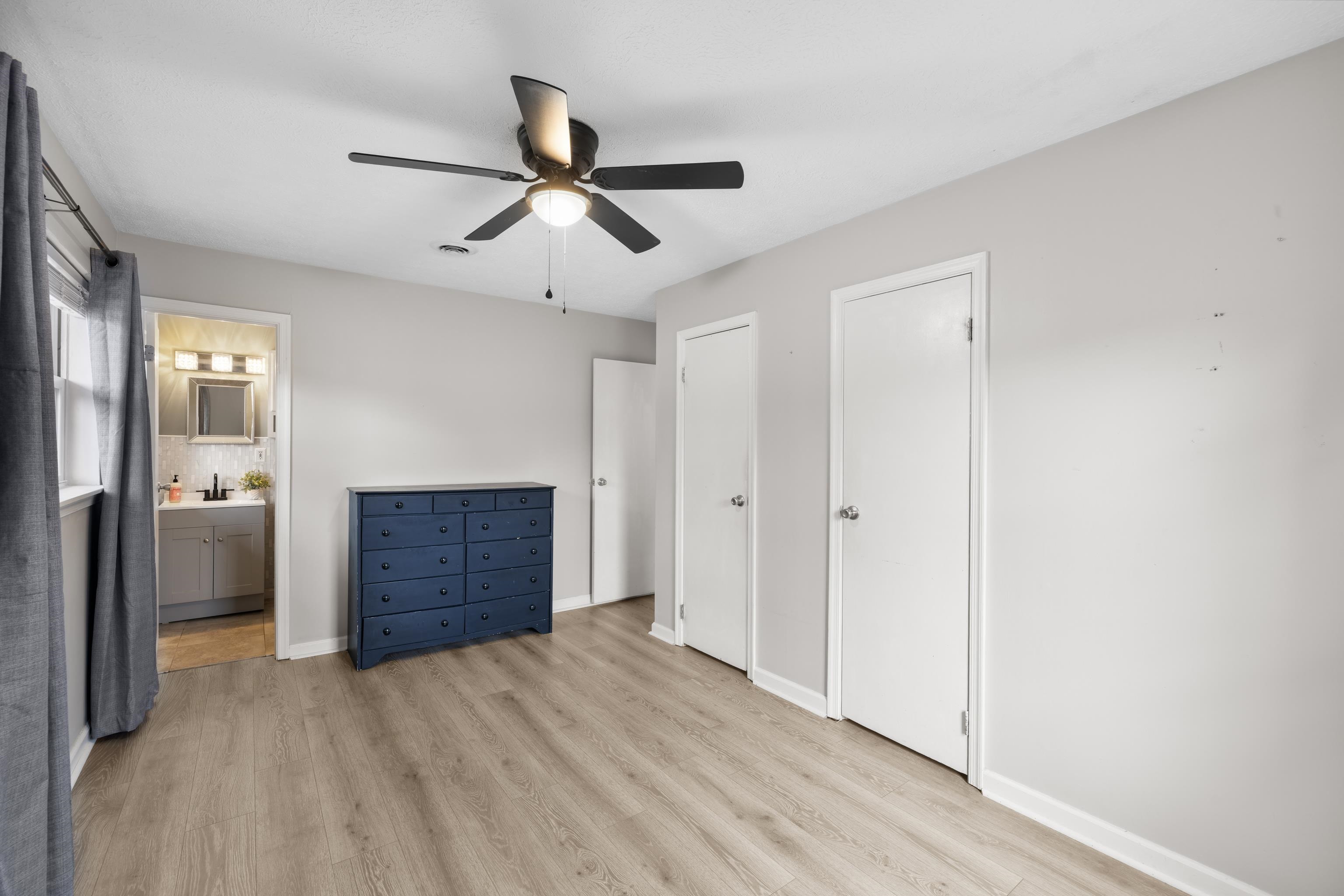 77 Greenway Road Stuarts Draft, VA 24477 - Photo 28 of 57 a bedroom with a bed and a dresser