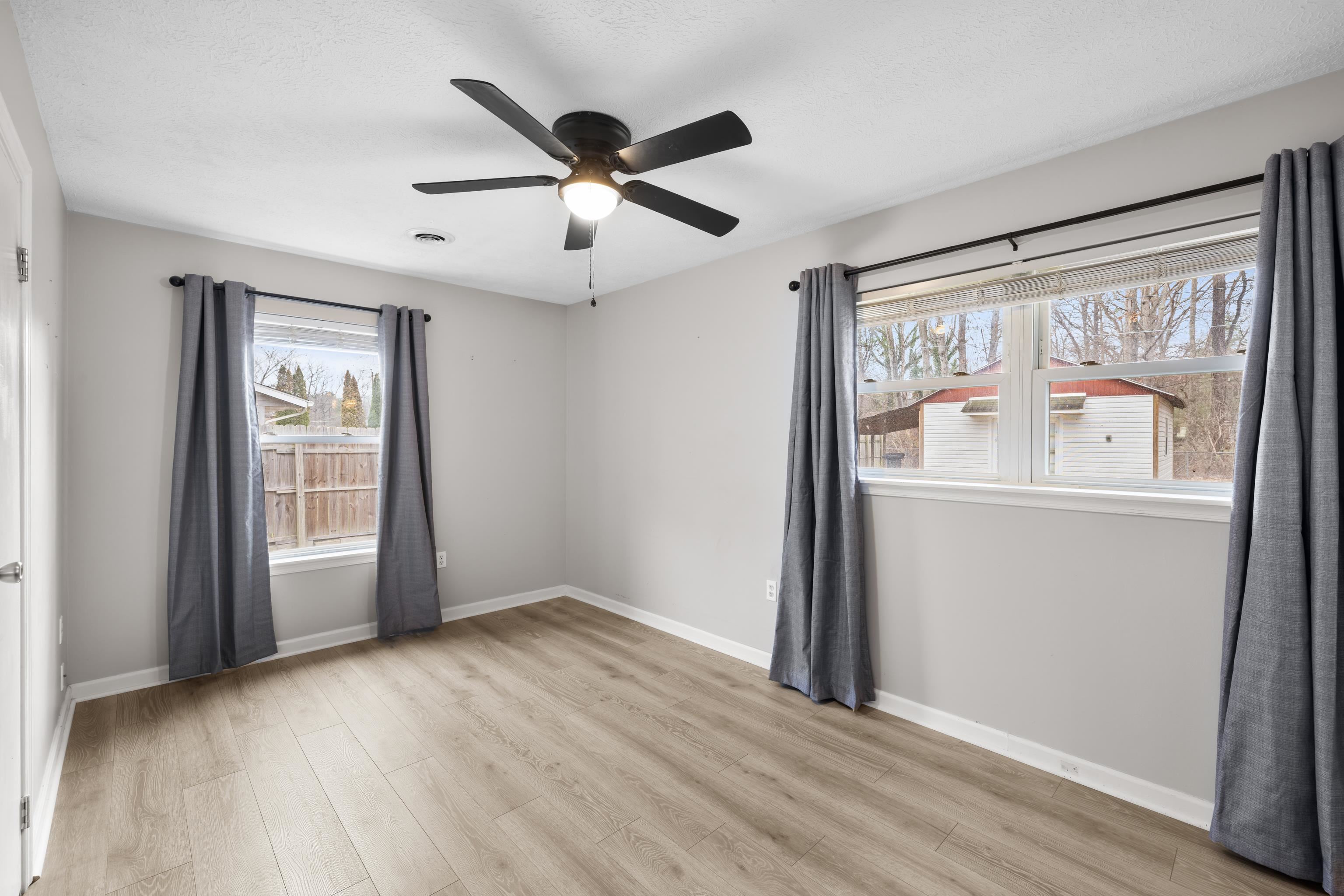 77 Greenway Road Stuarts Draft, VA 24477 - Photo 29 of 57 wooden floor in an empty room with a window