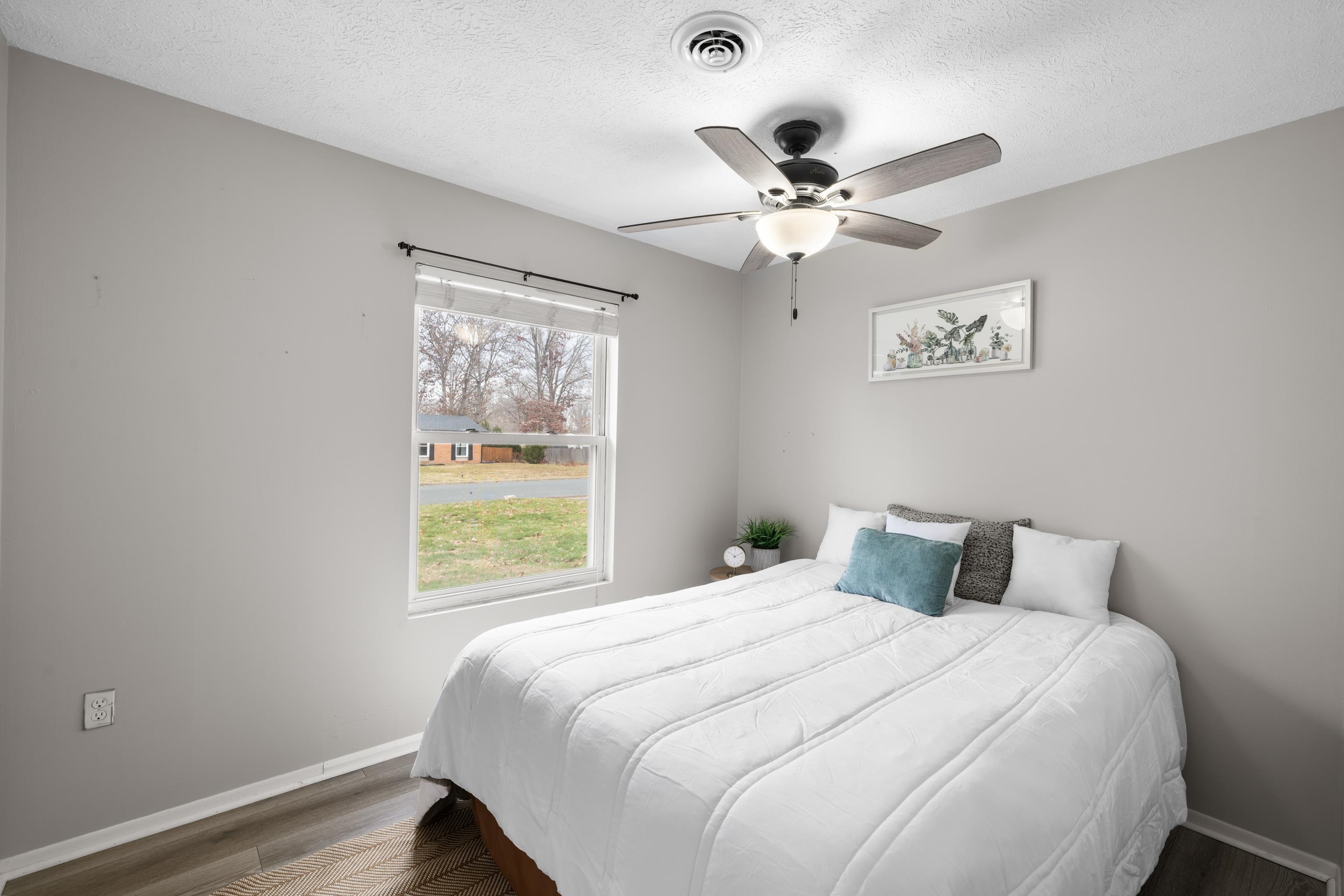 77 Greenway Road Stuarts Draft, VA 24477 - Photo 38 of 57 a bedroom with a large bed and a window