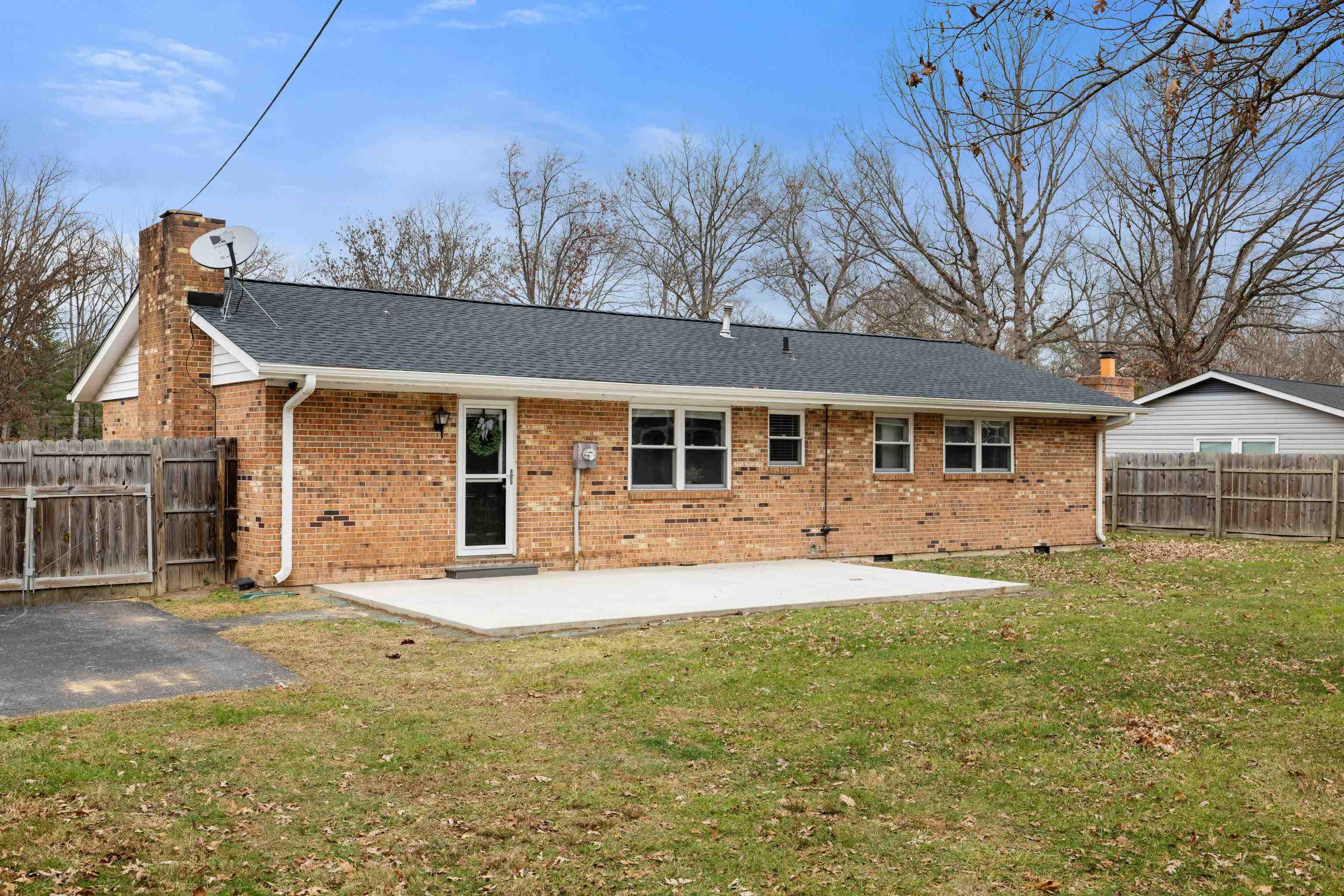 77 Greenway Road Stuarts Draft, VA 24477 - Photo 44 of 57 a front view of a house with a garden and yard
