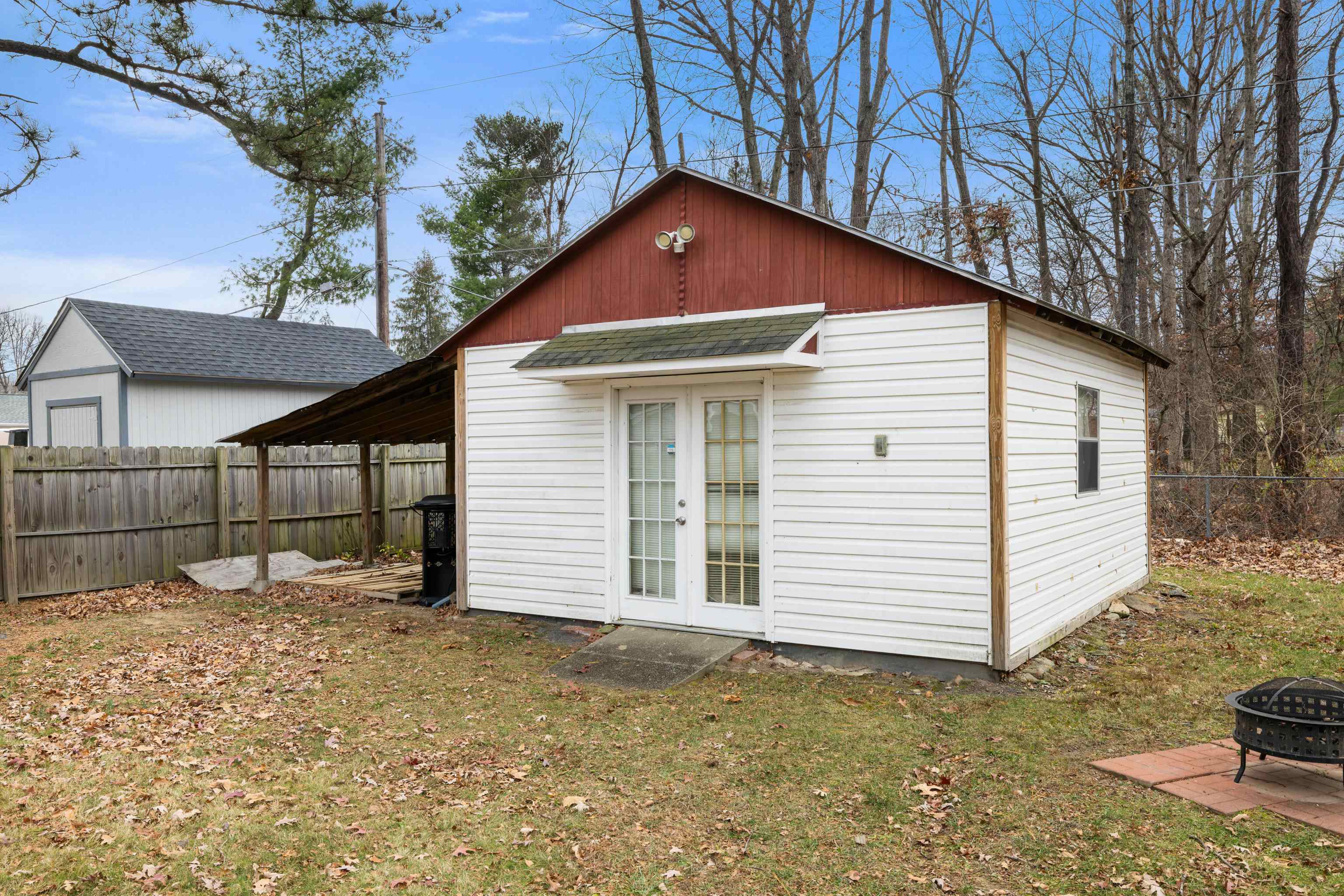 77 Greenway Road Stuarts Draft, VA 24477 - Photo 48 of 57 a front view of a house with a yard and garage