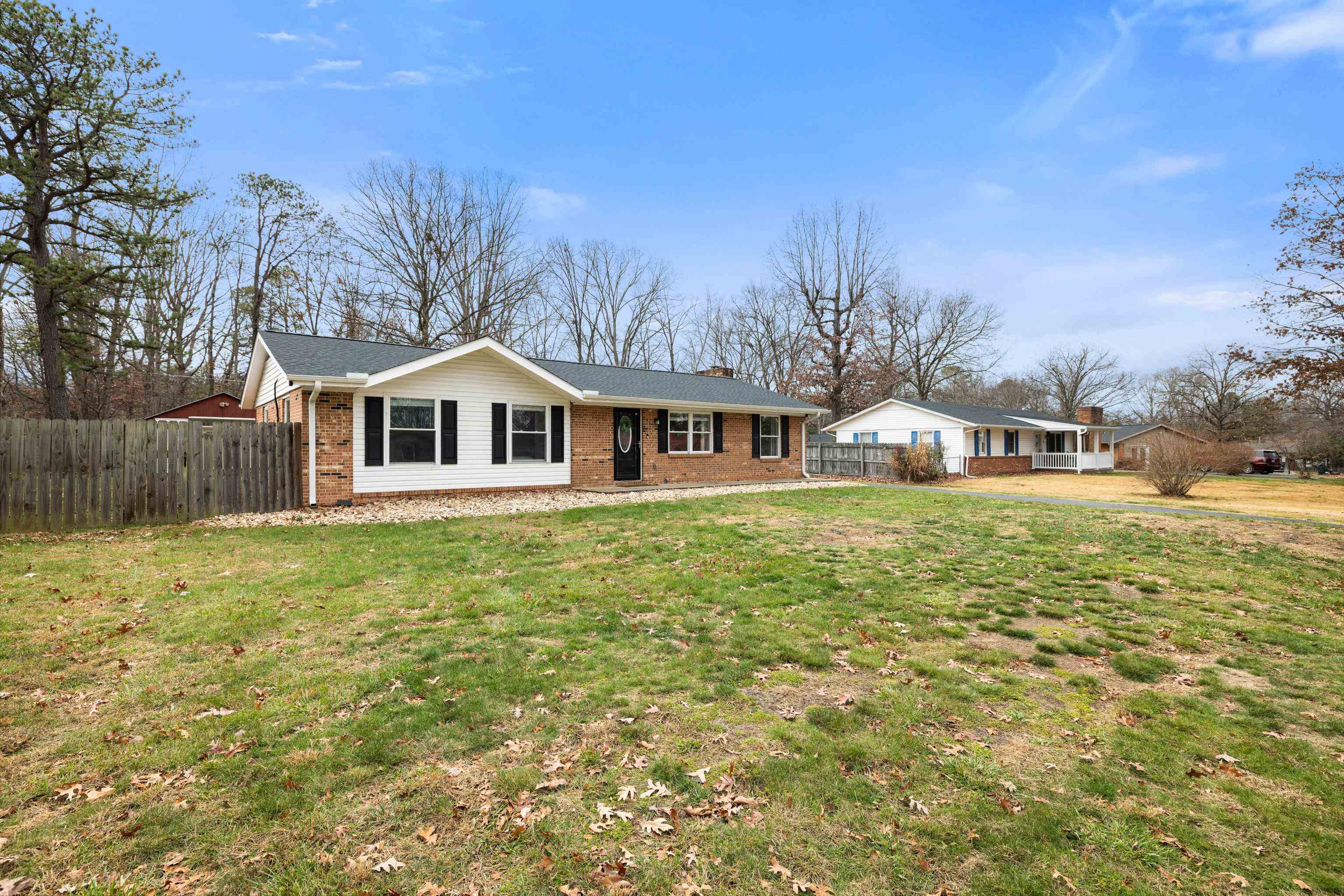 77 Greenway Road Stuarts Draft, VA 24477 - Photo 6 of 57 a front view of house with yard and trees in the background