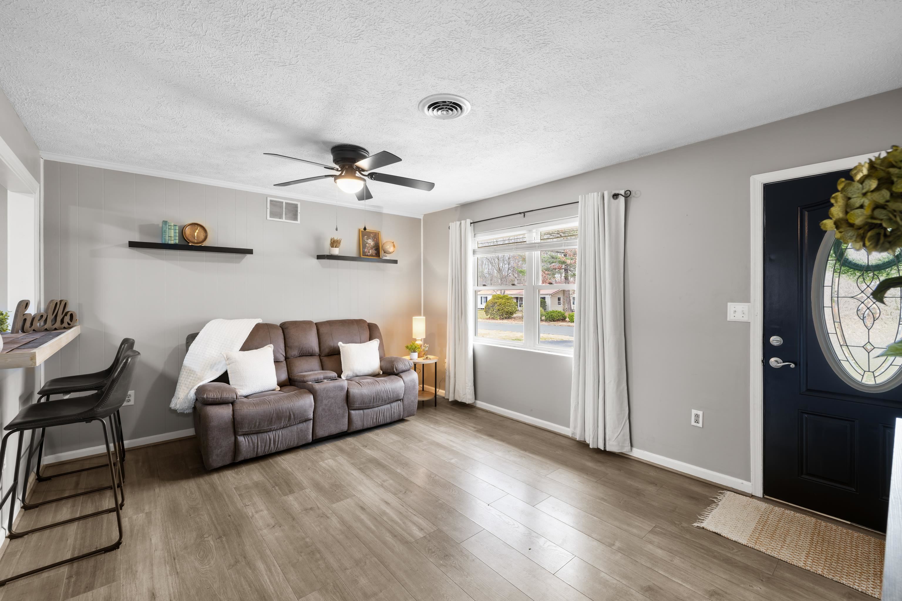77 Greenway Road Stuarts Draft, VA 24477 - Photo 8 of 57 a living room with furniture and a window