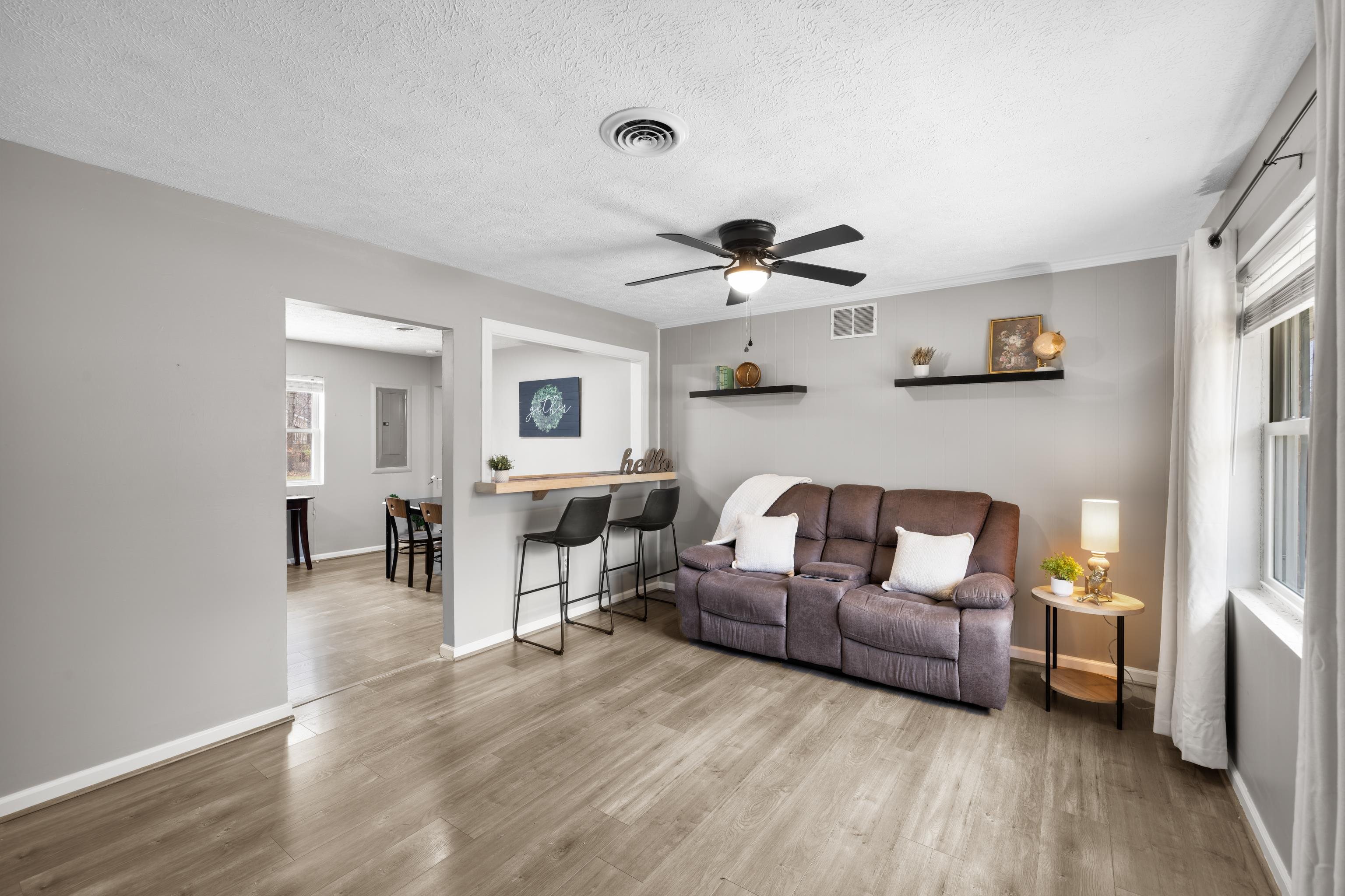 77 Greenway Road Stuarts Draft, VA 24477 - Photo 9 of 57 a living room with furniture and a wooden floor
